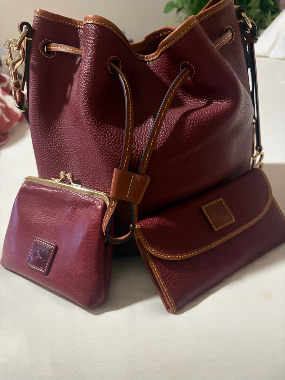 Dooney & Bourke Burgundy Pebbled Leather Drawstring Bucket Set with Tan Trim